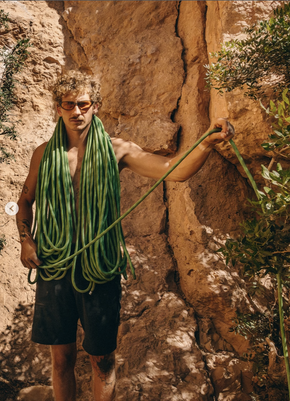 Andrija Radojević with a climbing rope at a rock wall